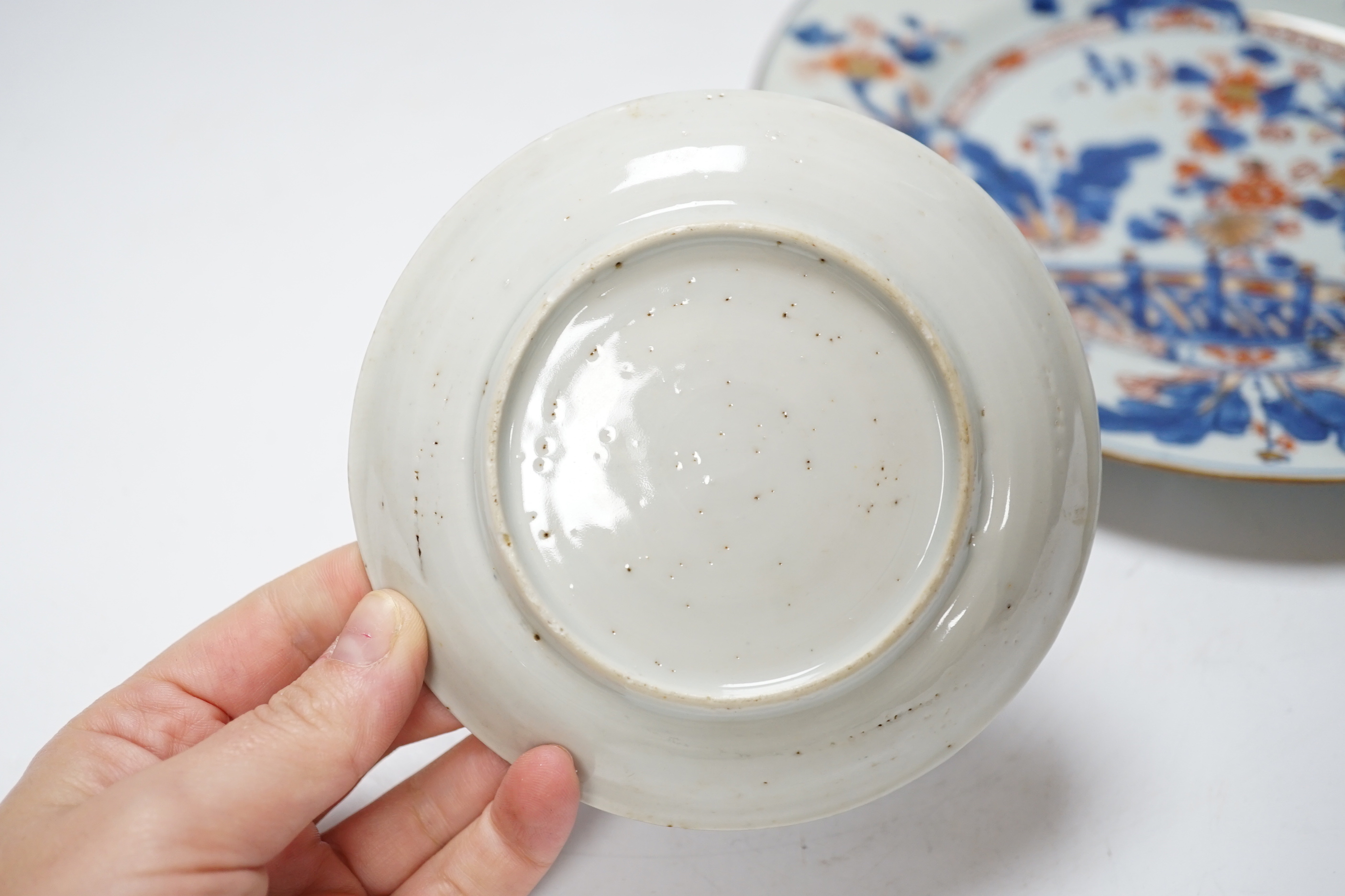 A collection of 18th century Chinese export plates and saucers